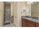 Bright bathroom with walk-in shower, granite vanity, and modern fixtures at 11407 Acacia Grove Ln, Riverview, FL 33579
