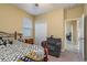 Bedroom featuring comfortable chair, closet, and natural light from the window at 11407 Acacia Grove Ln, Riverview, FL 33579