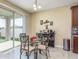 Bright dining area with sliding glass doors, a bar cart, and plenty of natural light at 11407 Acacia Grove Ln, Riverview, FL 33579