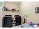 Efficient laundry room featuring modern appliances and ample storage space for convenience at 11407 Acacia Grove Ln, Riverview, FL 33579