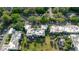 Aerial view of condo complex with ample parking and green spaces between buildings at 14419 Americana Cir # 103, Tampa, FL 33613