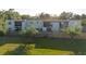 Backyard view with a well maintained lawn and a quaint privacy fence at 14419 Americana Cir # 103, Tampa, FL 33613