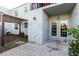 Back patio area with a pergola, privacy fence, and a view of the building exterior at 14419 Americana Cir # 103, Tampa, FL 33613