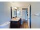 A bathroom featuring vanity with a large mirror, and access to the hallway at 14419 Americana Cir # 103, Tampa, FL 33613