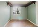 This bedroom features neutral green walls and a large window with trim accents at 14419 Americana Cir # 103, Tampa, FL 33613