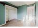 Bedroom with built in closet and shelving and view to hallway and closet space at 14419 Americana Cir # 103, Tampa, FL 33613