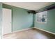 A cozy bedroom with neutral walls, a window for natural light, and trim at 14419 Americana Cir # 103, Tampa, FL 33613