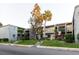 Attractive condo complex with well-maintained landscaping, lush green lawn and mature trees at 14419 Americana Cir # 103, Tampa, FL 33613
