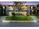 This building's exterior showcases beautiful trees and landscaping, enhancing its curb appeal and blending with nature at 14419 Americana Cir # 103, Tampa, FL 33613