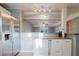 Modern kitchen featuring stainless steel appliances, light blue walls and open concept view into living area at 14419 Americana Cir # 103, Tampa, FL 33613