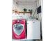 Efficient laundry room with modern washer and dryer setup for convenient chores at 14419 Americana Cir # 103, Tampa, FL 33613