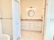 This bathroom includes a spacious vanity with ample storage and stylish fixtures at 16204 3Rd E St, Redington Beach, FL 33708