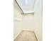 Walk-in closet includes carpeted floor and useful shelf space at 16204 3Rd E St, Redington Beach, FL 33708
