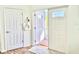 Bright foyer featuring hardwood floors, closet, and doorway that leads to a porch at 16204 3Rd E St, Redington Beach, FL 33708
