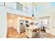 Modern kitchen with stainless steel appliances, island with seating, and a breakfast nook at 16204 3Rd E St, Redington Beach, FL 33708