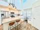 Bright kitchen features stainless steel appliances, pendant lighting, and cozy breakfast nook at 16204 3Rd E St, Redington Beach, FL 33708