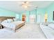 Airy main bedroom with ample seating area, balcony access, a walk-in closet, and ensuite bathroom at 16204 3Rd E St, Redington Beach, FL 33708