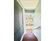 View down the stairs to the lush backyard with plenty of vegetation at 16204 3Rd E St, Redington Beach, FL 33708