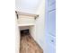 Charming walk-in closet featuring laminated wood flooring and custom shelving for optimal storage solutions at 16204 3Rd E St, Redington Beach, FL 33708