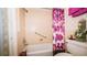 Bathroom featuring a combination tub and shower with a shower curtain and coordinating towels at 1655 S Highland Ave # F126, Clearwater, FL 33756