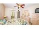 Inviting bedroom showcases a cozy bed, a dresser, and ample closet space at 1655 S Highland Ave # F126, Clearwater, FL 33756