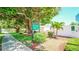 Front entrance sign and lush greenery enhance the curb appeal of the community at 1655 S Highland Ave # F126, Clearwater, FL 33756