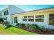 Exterior featuring well-maintained lawn and patio with sliding glass door access at 1655 S Highland Ave # F126, Clearwater, FL 33756