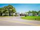 Community street view with well-maintained landscaping and covered parking at 1655 S Highland Ave # F126, Clearwater, FL 33756