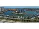 Aerial view of condos, a pool, marina, and waterfront property at 1660 Gulf Blvd # Ph-7, Clearwater Beach, FL 33767