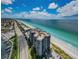 Stunning aerial view of the beach condo with ocean views and manicured grounds at 1660 Gulf Blvd # Ph-7, Clearwater Beach, FL 33767