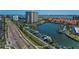 Aerial view of a waterfront condo community, showcasing lush landscaping, boat docks, and scenic surroundings at 1660 Gulf Blvd # Ph-7, Clearwater Beach, FL 33767