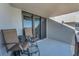 Condo balcony with chairs, offering outdoor seating and space for relaxation at 1660 Gulf Blvd # Ph-7, Clearwater Beach, FL 33767