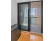 View of balcony through sliding glass door with black frame and handle at 1660 Gulf Blvd # Ph-7, Clearwater Beach, FL 33767