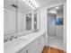 Bathroom featuring a double vanity and a walk-in shower with glass door at 1660 Gulf Blvd # Ph-7, Clearwater Beach, FL 33767