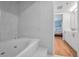Bathroom featuring a soaking tub and a vanity with white cabinets at 1660 Gulf Blvd # Ph-7, Clearwater Beach, FL 33767