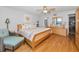 Bright bedroom featuring hardwood floors and furniture at 1660 Gulf Blvd # Ph-7, Clearwater Beach, FL 33767