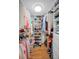 Walk-in closet with custom shelves and hanging racks for ample storage at 1660 Gulf Blvd # Ph-7, Clearwater Beach, FL 33767