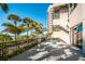 The outdoor deck overlooks palm trees, a beach walk and views of the coast at 1660 Gulf Blvd # Ph-7, Clearwater Beach, FL 33767