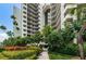 Beautiful condo building entrance with lush landscaping at 1660 Gulf Blvd # Ph-7, Clearwater Beach, FL 33767