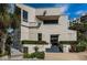 Attractive exterior of a building featuring architectural details, a manicured landscape, and clear signage at 1660 Gulf Blvd # Ph-7, Clearwater Beach, FL 33767
