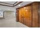 Hallway featuring wood doors, carpet and brick accents at 1660 Gulf Blvd # Ph-7, Clearwater Beach, FL 33767