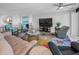 Comfortable living room featuring a fireplace, large-screen TV, and elegant, modern decor at 1660 Gulf Blvd # Ph-7, Clearwater Beach, FL 33767