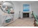 Stylish living room fireplace with nautical decor, including a ship model and sea-inspired art at 1660 Gulf Blvd # Ph-7, Clearwater Beach, FL 33767