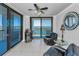 Cozy living room with balcony access and scenic water views at 1660 Gulf Blvd # Ph-7, Clearwater Beach, FL 33767