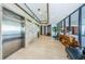 Condo lobby featuring elevators, seating area, wood accents and tile flooring at 1660 Gulf Blvd # Ph-7, Clearwater Beach, FL 33767