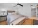 Main bedroom boasts wood floors, neutral walls, and a ceiling fan at 1660 Gulf Blvd # Ph-7, Clearwater Beach, FL 33767