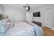 Bedroom with a queen-sized bed, a ceiling fan, and a television at 1660 Gulf Blvd # Ph-7, Clearwater Beach, FL 33767