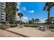 Patio with tables and chairs and a view of the ocean at 1660 Gulf Blvd # Ph-7, Clearwater Beach, FL 33767