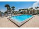 Enjoy a refreshing swim in this inviting pool surrounded by lush landscaping and resort-style amenities at 1660 Gulf Blvd # Ph-7, Clearwater Beach, FL 33767
