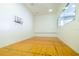 This is a racquetball court with wood flooring and a basketball hoop on the wall at 1660 Gulf Blvd # Ph-7, Clearwater Beach, FL 33767
